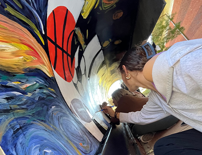  Image of students painting plwoer